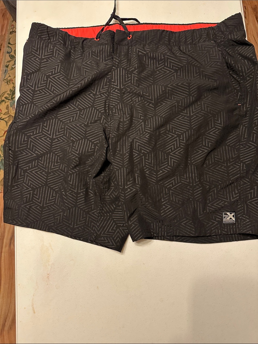 ZeroXposur Black Swim Shorts with Orange Trim and Silver Lining